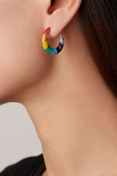 Somewhere over the rainbow. These hoops are the perfect transition piece to take you from day to night. Features a multicolor rainbow enamel surrounding a stripe pattern. Lip Stud, Rainbow Ring, Alison Lou, Somewhere Over The Rainbow, Rainbow Rings, Rainbow Jewelry, Rainbow Earrings, Star Studs, Heart Studs