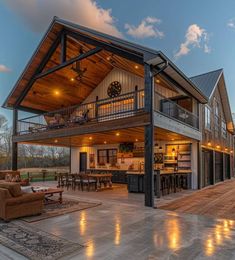 a large open floor plan with lots of furniture and lighting in the living room area