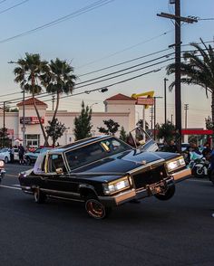 a car that is upside down in the street