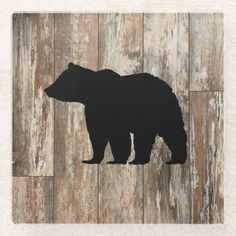 a black bear silhouette on a wooden background