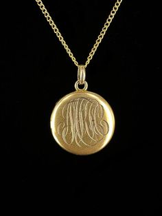 Antique Victorian 10k Gold Initial Engraved Picture Locket Necklace 18"  Item here is an antique Victorian 10k gold initial engraved picture locket necklace. This pendant is unmarked but tests for 10k gold and hangs on a 12k gold filled chain that closes with a spring ring. The initials appear to say "MKH", but are hard to make out due to the font. Locket includes two pictures of a couple from the early 1900's. Very cool and well made gold locket.  Condition: Good; item is pre-owned and may have some signs of light use and age related wear. Please look closely at the pictures provided as they are an extension of our written description. Measurements: Chain Length: 18 in Chain Width: 1.2 mm Locket: ¾ in, 1.5 dwt Weight: 3.5g 9010F Luxury Ornate Oval Pendant Necklace, Vintage 14k Gold Locket Necklace Stamped 14k, Vintage 14k Gold Locket Necklace, Antique 14k Stamped Jewelry For Ceremonial Occasions, Victorian Round Locket Necklace Stamped 14k, Antique Medallion Locket Necklace Stamped 14k, Collectible Coin-shaped Elegant Necklace, Bronze Vintage Charm Jewelry For Anniversary, Bronze Jewelry With Vintage Charm For Anniversary