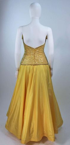 For Sale on 1stDibs - This Murray Arbeid gown is composed of a yellow silk and features silver sequin applique. The structured bodice features an exaggerated bust and interior Sequin Appliques, Yellow Silk, Strapless Gown, Silver Sequin, Bodice, Evening Dresses, 1970s, Full Length, Sequin