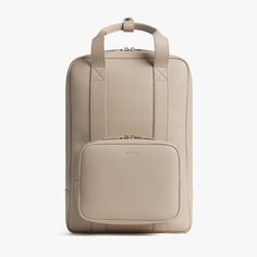 Ivory (Vegan Leather) | Front view of Metro Backpack Ivory Sustainable Backpack, Carry On Packing, Suitcase Handle, Packing Guide, Leather Finish, Passport Wallet, Gym Clothes, Leather Accents, Carbon Black