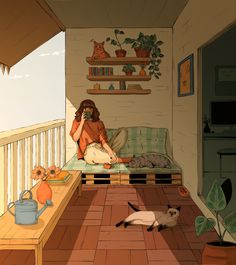 a woman sitting on a porch next to a cat and another cat laying on the floor