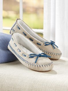 These fun mocs add a pop of color in an enduring style that's a favorite for its casual looks and easy fit. The soft suede upper is saturated in color and crafted with working "skip laces" and topstitch detailing. The inside is lined with quilted brushed terry that surrounds the deep memory foam footbed. Slip-on moccasin-style slippers Soft suede upper Lined with quilted brushed terry Deep memory foam footbed Working skip lacing adjusts for the most comfortable fit EVA rubber outsole Upper, sued Luxury Designer Plain Toe Moccasins, Elegant Luxury Moccasins With Textured Sole, Luxury White Moccasins With Branded Insole, Luxury Casual Slip-on Moccasins, Timeless Luxury Moccasins For Semi-formal Occasions, Luxury Chic Round Toe Moccasins, Luxury Formal Slip-on Moccasins, Luxury Modern Moccasins With Flat Heel, Luxury Low-top Formal Moccasins