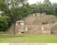 an ancient building with steps leading up to it's roof and trees in the background