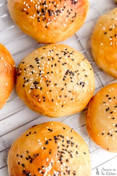 sesame seed bagels on a cooling rack ready to be baked into buns or muffins