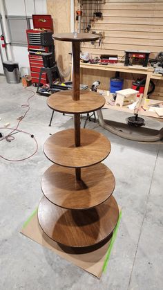 three tiered wooden stand in a garage