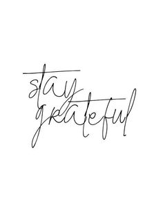 the word stay grateful written in cursive writing on a white background with black ink