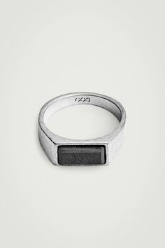 A refined take on the classic signet ring, this iteration has an elongated bezel that's centred by a semi-precious hematite stone. It is framed by a slightly oxidised band for undone appeal and has our signature emblem engraved subtly inside. Brass is a versatile material that can be recycled numerous times without losing any of its properties Shell: 90% Post-consumer recycled brass, 10% Semi-precious stone. Excluding trims Internal ring width of XS/S: 1.8cm. Internal ring width of M/L: 2cm Hematite Stone, Belt Jewelry, Cashmere Coat, Quilted Bag, Signet Ring, Semiprecious Stones, Precious Stones, Semi Precious, Blouse And Skirt