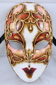 Our masks are made according to the oldest Venetian techniques and with the most innovative materials in the sector. Each mask is a unique craftsmanship that comes directly to your home, created and customized just for you. With this mask you will impress everyone at any dance or costume party. 🎭 🎃 The mask is unisex and one size fits all. 👩🏽 👨🏼 It is made from hypoallergenic and certified materials. ✅ Only manufactured in Italy. 🇮🇹 What are you waiting for to order it? You can also requ Artistic Costume Masks For Festivals, Venetian Full Face Halloween Mask, Venetian Full Face Mask For Halloween, Artistic Red Masks And Prosthetics For Theater, Full Face Venetian Halloween Mask, Artistic Masks For Festivals And Costume Parties, Artistic Masks For Costume Festivals, Artistic Red Masquerade Mask For Mardi Gras, Artistic Masks For Costume Party And Festivals