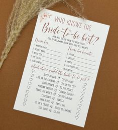 a wedding game with the bride to be written on it next to some dried grass