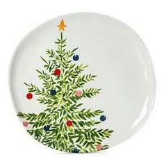 a white plate with a christmas tree painted on it