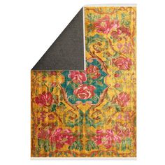 an area rug with flowers and leaves on it