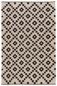 a black and white rug with squares on it