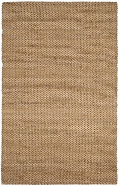 a beige rug with small squares on the top and bottom, it is made out of ju