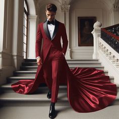 a man in a red suit and bow tie is walking down the stairs with his hand on his hip