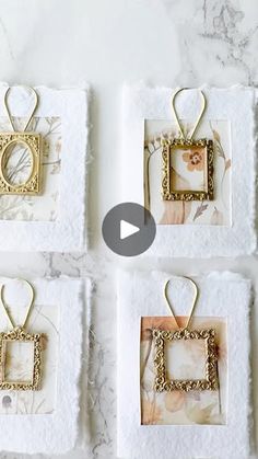 four square pictures hanging on towels with gold trimmings and an ornament