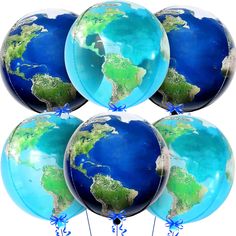 blue and green globe balloons with bows tied around the edges are shown in front of a white background