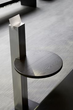 a table that has some sort of object on it's stand in the middle of a room