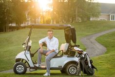 a man sitting on the back of a golf cart