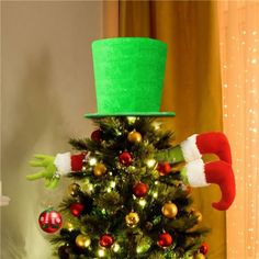 a christmas tree with an elf's hat on top