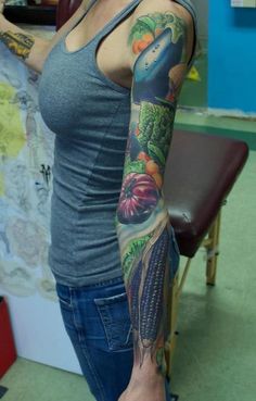 a woman with a tattoo on her arm