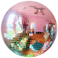 a disco ball with many different colored tiles on it's side and the reflection of another object in the mirror