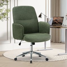 a green office chair sitting on top of a white rug