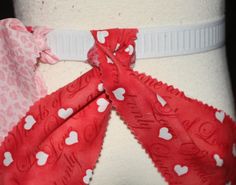 a close up view of the back of a woman's panties with hearts on it