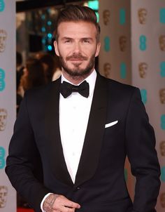 David Beckham wears a black tuxedo, white tuxedo shirt, and black bow tie Black Suit Combinations, Suit Color Combinations, Australia Adelaide, Karaoke Bar, Black Tie Attire, Black Tie Formal, Shirt And Tie, Evening Style