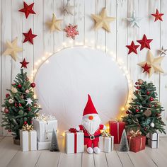 a christmas scene with presents and santa clause in front of a large white circle surrounded by stars