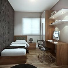 a bedroom with two beds and a desk in the corner next to a computer monitor