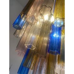 several different colored lights hanging from the ceiling