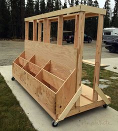 a wooden structure sitting on top of a sidewalk