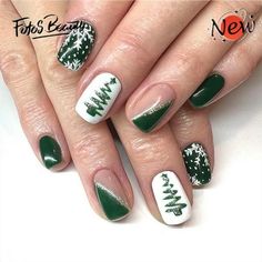 green and white christmas nail art with trees on the tip of each manicures