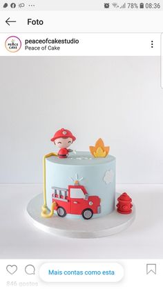 a birthday cake with a fireman on top