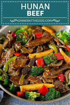 a bowl filled with beef, broccoli and peppers