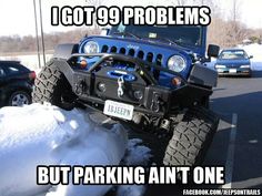 the jeep is parked in the parking lot with snow piled on it's tires