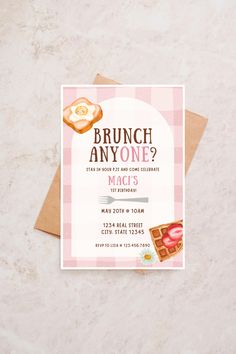 a brunch party is on the table with pink and white checkered paper