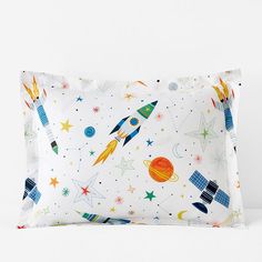 a pillow case with an image of rockets and stars on it