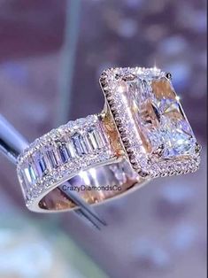 an engagement ring with two emerald cut diamonds