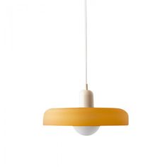 an orange and white light hanging from a ceiling