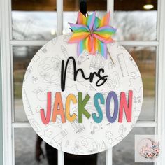 a door hanger with the name mrs jackson on it in front of a window