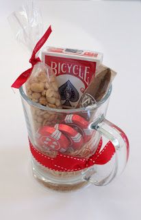 a glass cup filled with candy and cookies