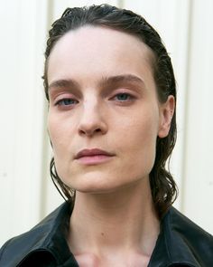 a close up of a person wearing a black jacket