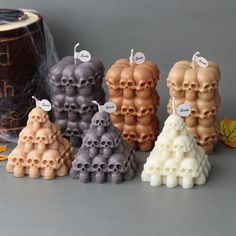 there are several candles that have skulls on them