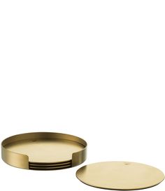 two round brass trays sitting next to each other