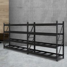 an industrial shelving unit with four shelves on the bottom and one shelf below it