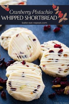 cranberry pistachio whipped shortbread cookies with white frosting and dried cranberries